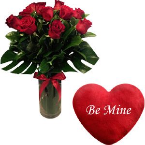 Roses in vase and heart shape pillow